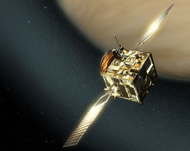 This illustration of Venus Express shows it amid charged particles of solar wind in the upper layers of the Venusian atmosphere. (credit: ESA, AOES Medialab)