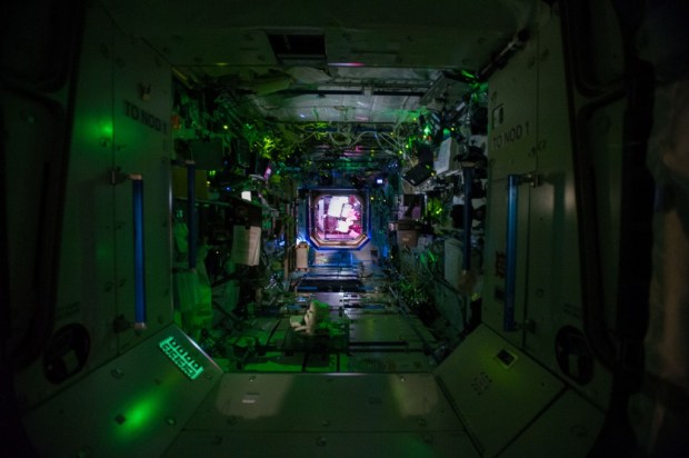 This view is looking into the Destiny Laboratory from Node 1 (Unity) with Node 2 (Harmony) in the background. Destiny is the primary research laboratory for U.S. payloads, supporting a wide range of experiments and studies. (Credit NASA)