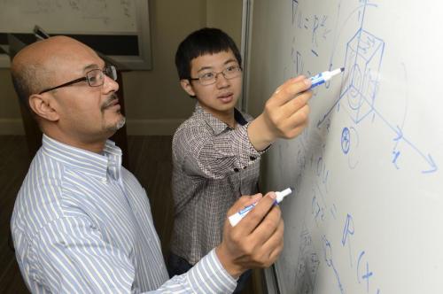 ohns Hopkins graduate student Xiang Yang, at right, teamed up with Rajat Mittal, a professor of mechanical engineering, to revamp a "useless" 169-year-old math strategy, making it work up to 200 times faster. (Credit: Will Kirk/JHU)