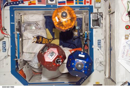 Three satellites fly in formation as part of the Synchronized Position Hold, Engage, Reorient, Experimental Satellites (SPHERES) investigation. This image was taken during Expedition 14 in the Destiny laboratory module. (Credit: NASA)