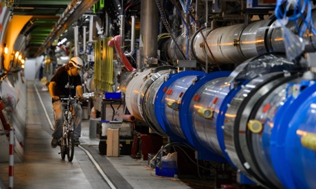 A worker rides on his bicycle in the CERN's Large Hadron Collider (LHC) tunnel during maintenance works. (Credit:  AFP  / FABRICE COFFRINIFABRICE COFFRINI/AFP/Getty Images)