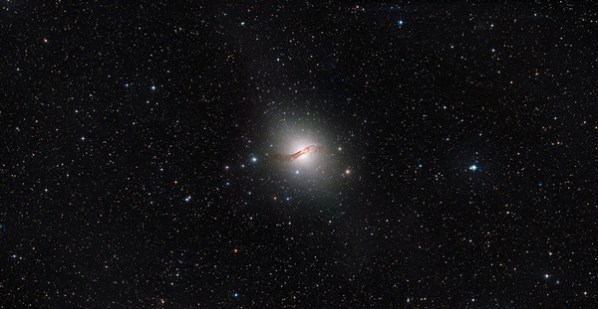 This image shows the stunning elliptical galaxy Centaurus A. Recently, astronomers have used the NASA/ESA Hubble Space Telescope to probe the outskirts of this galaxy to learn more about its dim halo of stars. (Credit: ESA/Hubble)/NASA/Digitized Sky Survey/MPG/ESO