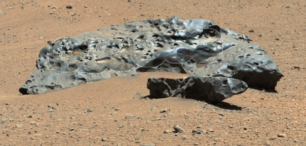 This photo by NASA's Curiosity Mars rover shows the huge iron meteorite "Lebanon" (7 feet wide) and its smaller companion "Lebanon B." The two meteorites were found by Curiosity on May 25, 2014. The circular insets are more detailed views by Curiosity's Chem-Cam instrument overlaid on an image by the rover's Remote Micro-Imager. (Credit: NASA/JPL-Caltech/LANL/CNES/IRAP/LPGNantes/CNRS/IAS/MSSS)