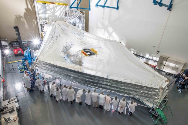 The James Webb Space Telescope (sometimes called JWST) is an orbiting infrared observatory that will complement and extend the discoveries of the Hubble Space Telescope, with longer wavelength coverage and greatly improved sensitivity.(Credit: NASA/Chris Gunn)