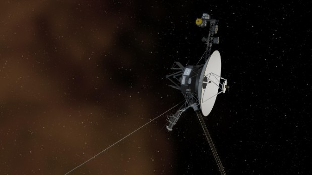 This artist’s concept shows the Voyager 1 spacecraft entering the space between stars. Interstellar space is dominated by plasma, ionized gas (illustrated here as brownish haze), that was thrown off by giant stars millions of years ago. (Credit: NASA/JPL-Caltech)