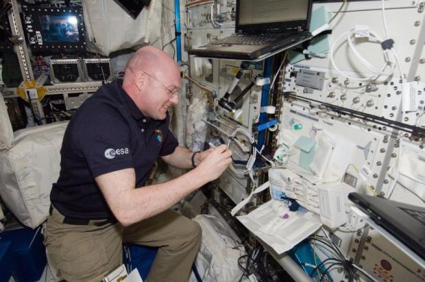 European Space Agency astronaut Andre Kuipers, Expedition 30 flight engineer, prepares vials in the Columbus laboratory of the International Space Station for venous blood sample draws during an immune system investigation. (Credit: NASA)