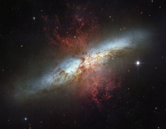 To celebrate the NASA-ESA Hubble Space Telescopes 16 years of success, NASA and the European Space Agency are releasing this mosaic image of the starburst galaxy, Messier 82 (M82),  made in March 2006. It is the sharpest wide-angle view ever obtained of M82, a galaxy remarkable for its webs of shredded clouds and flame-like plumes of glowing hydrogen blasting out from its central regions. Located 12 million light-years away, it is also called the "Cigar Galaxy" because of the elongated elliptical shape produced by the tilt of its starry disk relative to our line of sight. (AP Photo/NASA-ESA)