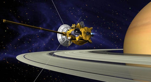 This is an artists concept of Cassini during the Saturn Orbit Insertion (SOI) maneuver, just after the main engine has begun firing. (Credit: NASA/JPL)
