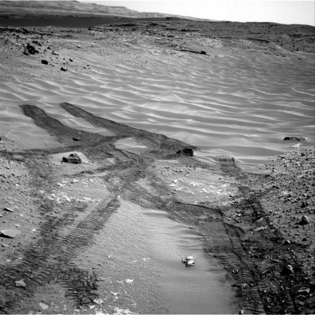 This image, taken by NASA's Mars rover Curiosity in August 2014, looks across the northeastern end of sandy "Hidden Valley" to the lower slopes of Mount Sharp on the horizon. (Credit: NASA/JPL-Caltech)