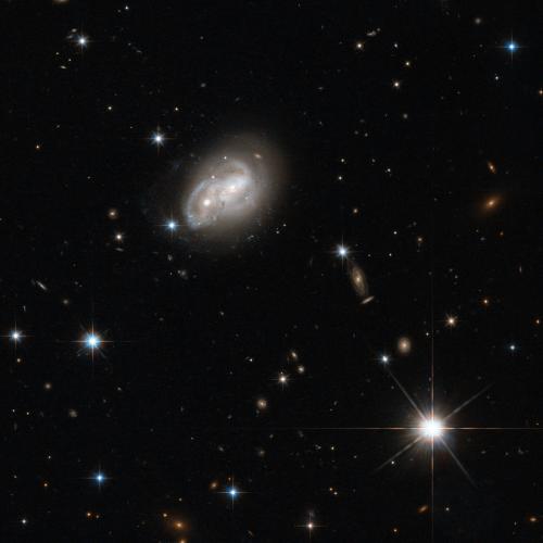 From objects as small as Newton's apple to those as large as a galaxy, no physical body is free from the stern bonds of gravity, as evidenced in this stunning picture captured by the Wide Field Camera 3 and Advanced Camera for Surveys onboard the NASA/ESA Hubble Space Telescope. (Credit: ESA/Hubble & NASA, Acknowledgement: Luca Limatola)