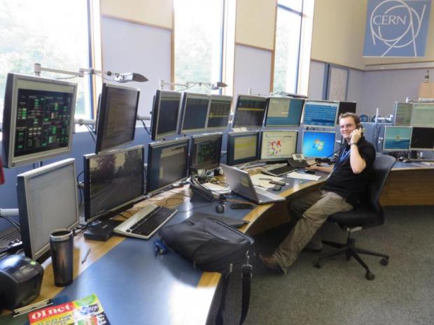 Chris Wetton of CERN's Technical Infrastructure Operation group keeps a keen eye on the monitors at the CERN Control Centre (Image: Stephanie Hills)