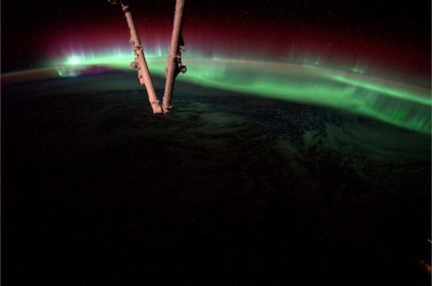 An aurora dances in the atmosphere on Aug. 20, 2014, as the International Space Station flew over North America. This image was captured by astronaut Reid Wiseman from his vantage point on the ISS. (Credit: NASA/Handout/QMI Agency)