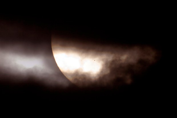 What’s that dot on the Sun? If you look closely, it is almost perfectly round. The dot is the result of an unusual type of solar eclipse that occurred in 2006. Usually it is the Earth’s Moon that eclipses the Sun. This time, the planet Mercury took a turn. (Credit: D. Cortner, NASA, K. Schmidt)