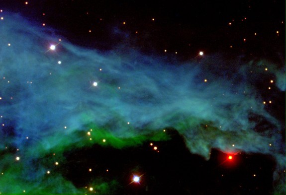 Shown above is part of one of the most imaged parts of the night sky, the Orion Nebula. Since the angular size of Orion's Nebula is so large on the sky, only a portion is shown here. Located just below "Orion's Belt" this star-forming region is dominated by four young, massive O stars (known as the Trapezium, not pictured here). The wispy blue, green gas seen above is composed mostly of hydrogen, the main element used in forming stars. The Orion Nebula is an astrophysical laboratory, providing an up-close view of the birth of stars (Credit: Sloan Digital Sky Survey)