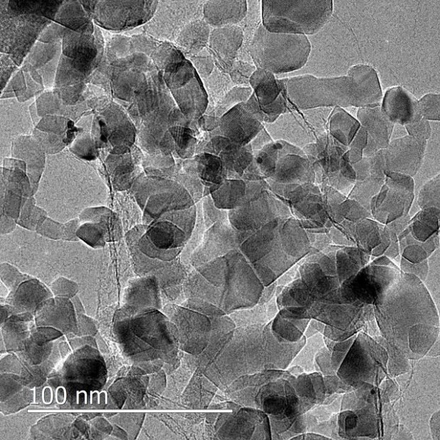 A transmission electron microscopic image of titanium dioxide plates resting on a near-invisible sheet of graphene. (Credit: Rozhkova et. al.)
