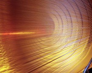 The Tevatron, the particle accelerator used to find the oscillating Bs meson, has huge detectors surrounded by a cylindrical 'tracking chamber', shown here. (Credit: Fermilab)