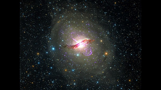 The nearby galaxy Centaurus A as viewed at X-ray, radio, and optical wavelengths, showing jets powered by a massive black hole at the center of the galaxy. (Credit: NASA)