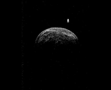 Radar image of asteroid 2004 BL86 made by the Green Bank Telescope from radar transmitted from NASA's Goldstone Deep Space Network antenna. It reveals clear surface features and a companion moon-like body. (Credit: NASA/JPL-Caltech; NRAO/AUI/NSF)