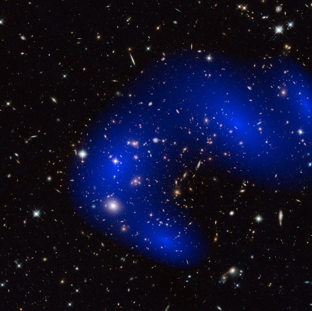 This is a NASA/ESA Hubble Space Telescope image of the galaxy cluster Abell 370. Shown in blue on the image is a map of the dark matter found within the cluster. (Credit NASA, ESA)