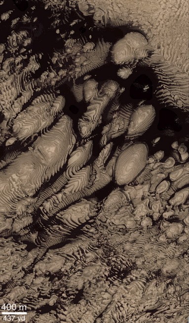 “Colorized” subframe of Mars Orbiter Camera image M14-01647 of layered deposits inside an impact crater in Western Arabia Terra. Hundreds of layers can be seen exposed by erosion. The layers are partially covered by dark debris that has filled in topographic lows between the layers. All the layers appear similar in their thicknesses and textures, suggesting they formed by the same process. What formed them? Perhaps deposition of sediments in water, or ash/dust settling out from the atmosphere. Illumination from the left. Figure courtesy of Malin Space Science Systems/NASA. 